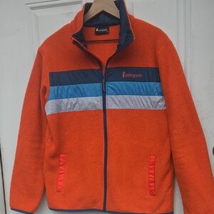 Cotopaxi Orange Fleece Jacket with Navy, Blue & Light Gray Stripes
